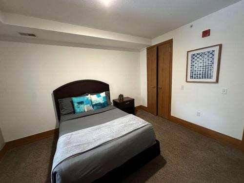 a bedroom with a large bed in a room at 2BR Balcony Suite with Parking at The Grand Castle in Grandville