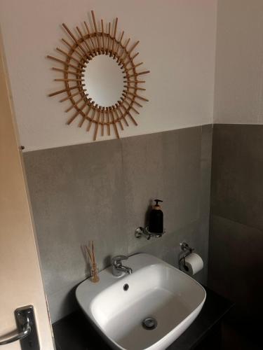 a bathroom with a sink and a mirror on the ceiling at 49 Bela-Bela Pendleberry Grove Holiday Unit 49 in Warmbaths