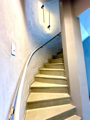 a stairway with two clocks on the wall at Bari 413 Dpto 2 B in La Rioja