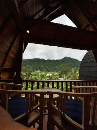 a view from the balcony of a house at Lumbung Kembar Sidemen in Sidemen
