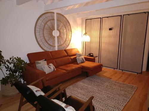 a living room with a couch and a rug at Our Place in Pico in Companhia de Cima