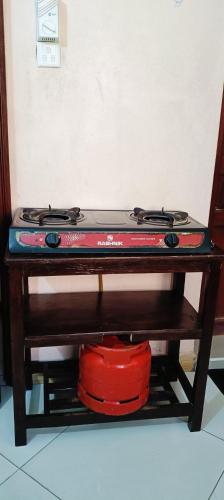a table with four pairs of skis on it at Phee home in Mombasa
