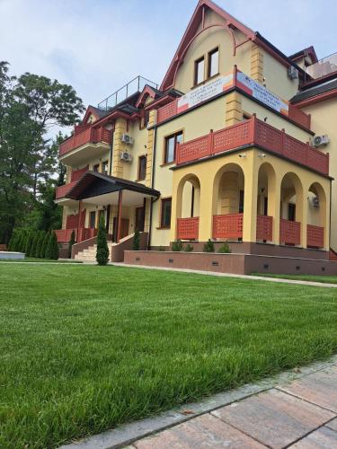a large house with a lawn in front of it at Diamond 2 in Palić