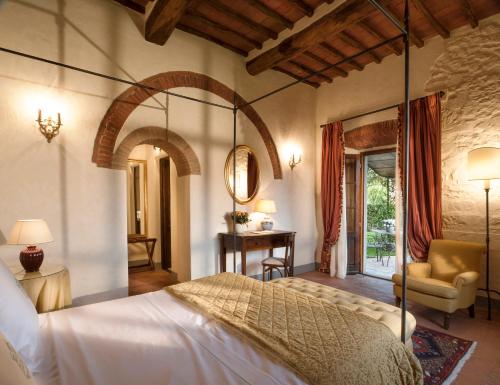a bedroom with a swinging bed in a room at Castello di Spaltenna Exclusive Resort & Spa in Gaiole in Chianti