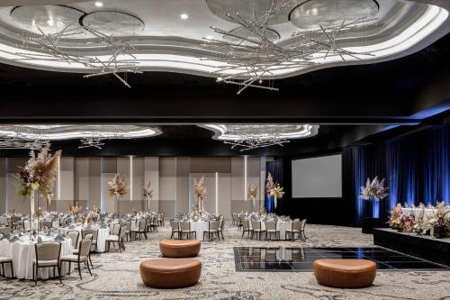 a banquet hall with white tables and chairs at Odessa Marriott Hotel & Conference Center in Odessa
