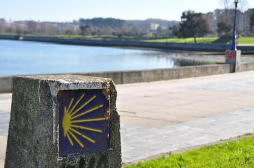 a sign with a yellow star on it next to a body of water at Hotel Crunia I A Coruña in A Coruña