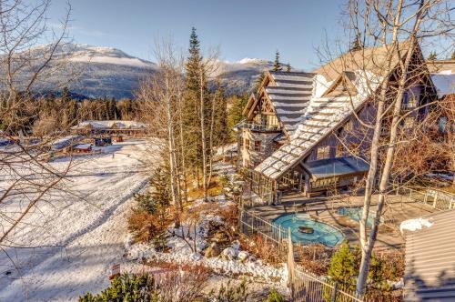 an aerial view of a house in the snow at THE LOOKOUT PENTHOUSE // a luxe suite in Whistler in Whistler