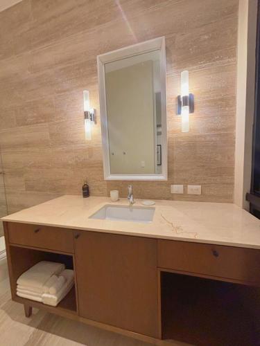 a bathroom with a sink and a mirror at Casa Continental Hotel Boutique & Suites - Adults Only in Mérida