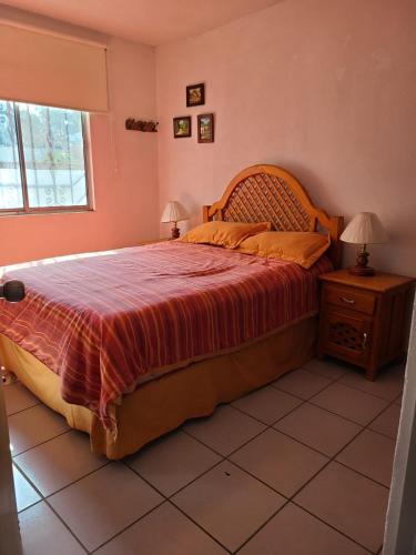 Ένα ή περισσότερα κρεβάτια σε δωμάτιο στο Casa Azahares Atlixco