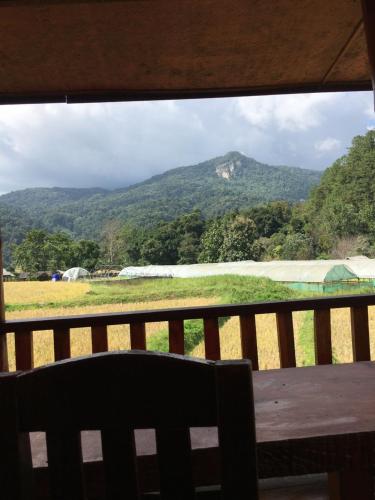 a view of a mountain from a window at Mukakee in Ban Sop Mae Klang