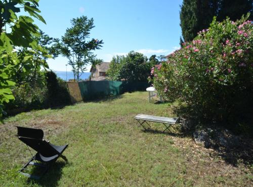 a chair and a bench in a yard at Charming Rovinj Haven in Rovinj