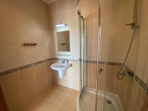a bathroom with a shower and a sink at Holiday Villapark-Seaview Albena - Villa 1-2 in Rogachevo