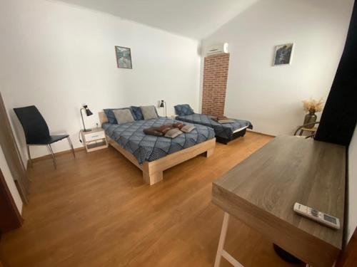 a living room with a bed and a couch at Holiday Villapark-Seaview Albena - Villa 1-2 in Rogachevo