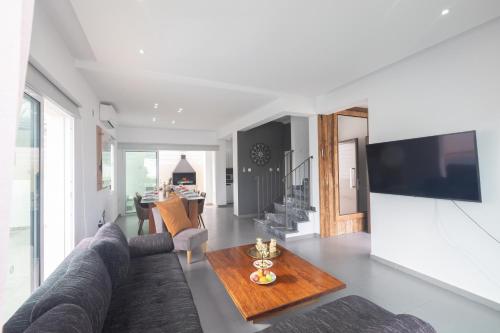 a living room with a couch and a table at Casa de Nicole in Protaras