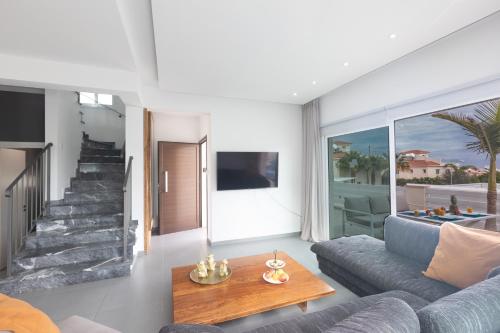 a living room with a couch and a table at Casa de Nicole in Protaras