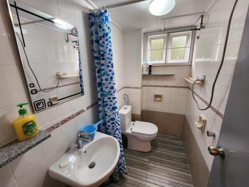a bathroom with a sink and a toilet at Little England B8-3 in Bukit Fraser
