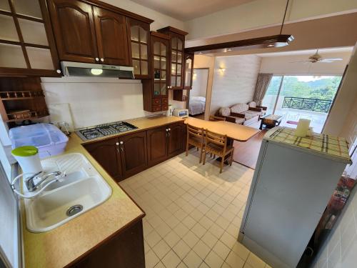 a kitchen with a sink and a counter top at Little England B8-3 in Bukit Fraser
