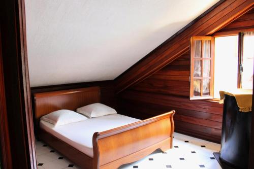 Ένα ή περισσότερα κρεβάτια σε δωμάτιο στο L'Habitation Firmant