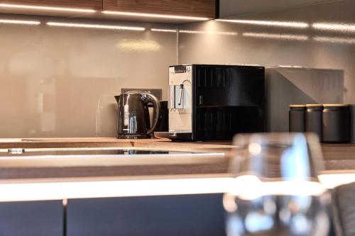 a coffee maker on a counter in a kitchen at Apartment Wood&Stone Alpi in Garmisch-Partenkirchen