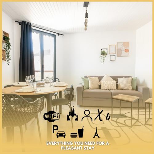 a living room with a couch and a table at Le 27 - Appartement Cosy - Disney 15min in Crecy la Chapelle