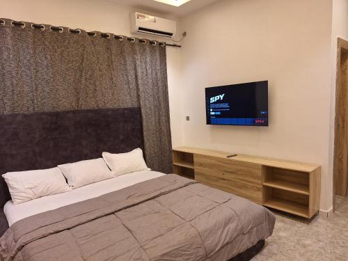 Postel nebo postele na pokoji v ubytování NPJ Suite