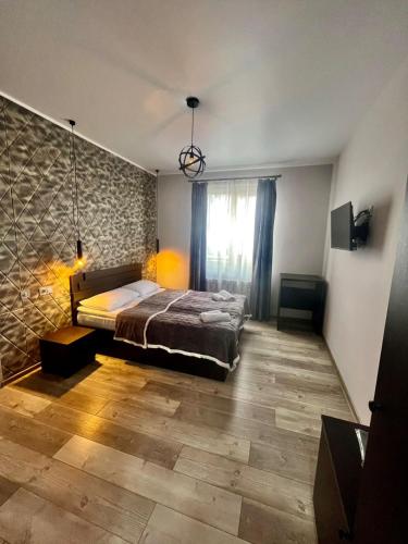 Una cama o camas en una habitación de Royal Galaxy