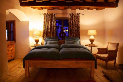 a bedroom with a bed and two lamps and a window at Living History (adults only) in Hallstatt