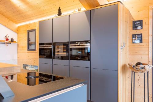 a large stainless steel refrigerator in a kitchen at Bergresort Hauser Kaibling by ALPS RESORTS in Haus im Ennstal