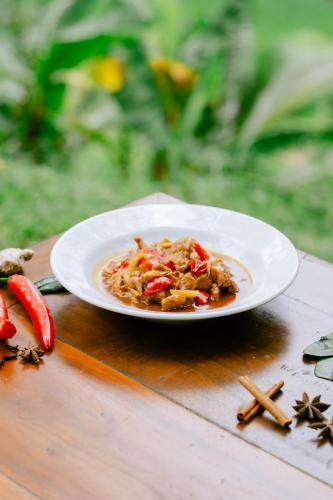a plate of food on top of a table at Saridevi Ecolodge in Jatiluwih