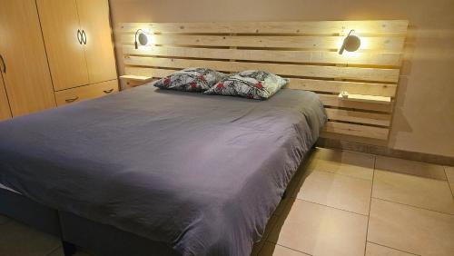 Postel nebo postele na pokoji v ubytování Gîte citadin de l'Entreville
