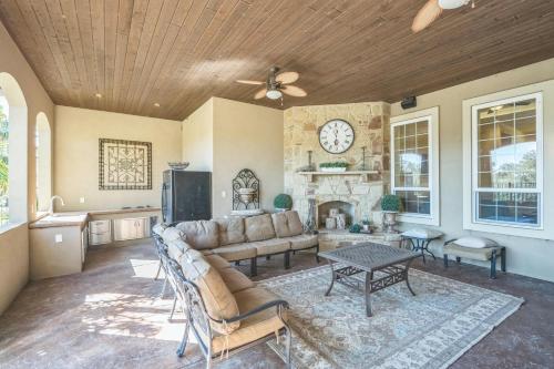 a living room with a couch and a fireplace at Luxurious 4-Bedroom Oasis with Private Pool in Seguin