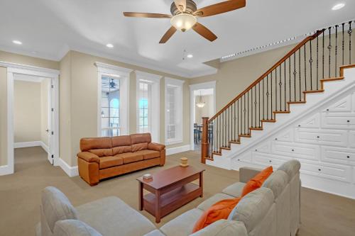 a living room with a couch and a ceiling fan at Luxurious 4-Bedroom Oasis with Private Pool in Seguin
