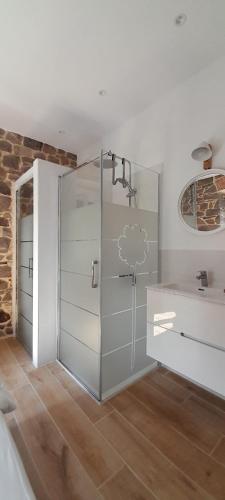 a bathroom with a shower and a glass door at Bellavista Room Bakio in Bakio