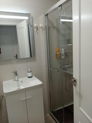 a bathroom with a shower and a sink and a mirror at La Casa De Mi Madre - 2 bed flat in the heart of Torrevieja in Torrevieja