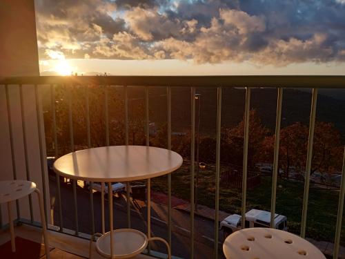 a view from a balcony with a table and chairs at Apartamentos entreRíos in Cazorla