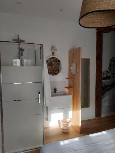 a bathroom with a glass door and a sink at Bellavista Room Bakio in Bakio