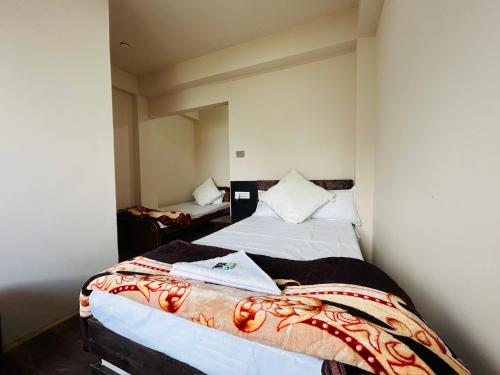 a bedroom with two beds in a room at Lava Hills Heaven Homestay in Lava