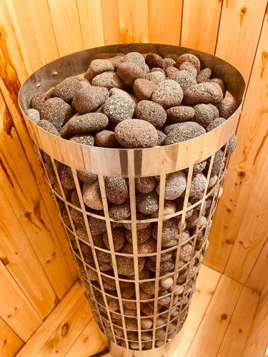 a bucket of chocolate donuts sitting on a wooden table at Antonis G. Hotel Apartments in Voroklini