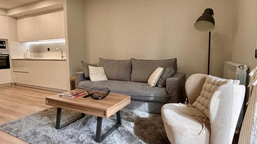 a living room with a couch and a coffee table at BPirineos-Llardana in Benasque