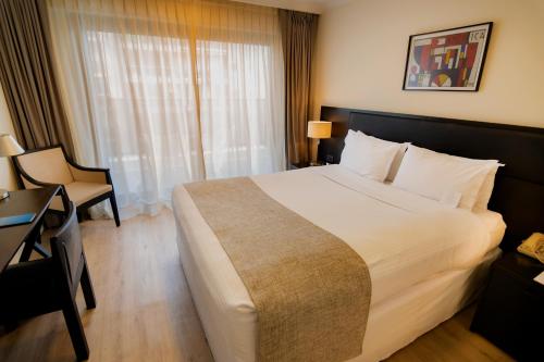 Letto o letti in una camera di After Hotel Montevideo