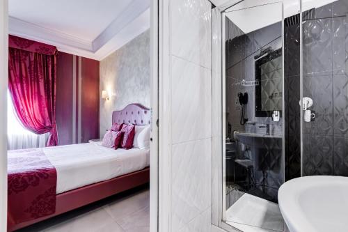 a bedroom with a bed and a shower and a sink at Navona Queen Rooftop in Rome