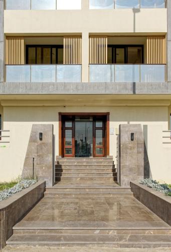 a building with stairs in front of it at Mynt Residence New Cairo one bedroom in Cairo