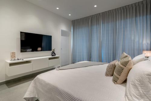 Caribbean Paradise Villa in Playa Nueva Romanaにあるベッド
