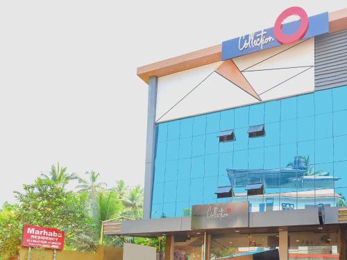 a building with a sign on the side of it at Super Collection O Marhaba Govindapuram in Calicut