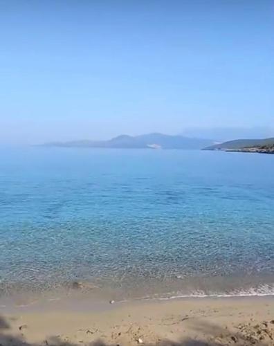 a large body of water with a beach at Villa Symphony apartments Kotor Tivat in Kotor