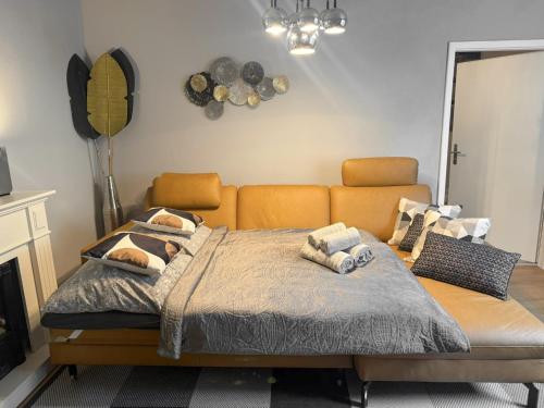 a bedroom with a bed with pillows on it at 80qm Luxus Apartment mit großer Terrasse in Saarbrücken