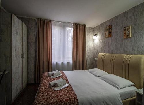 Postel nebo postele na pokoji v ubytování HotelHarmony