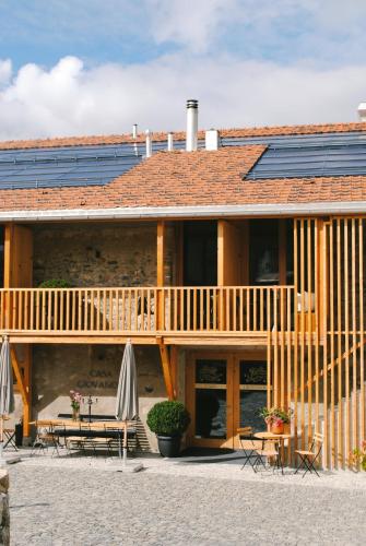 a house with solar panels on top of it at Boutique Hotel Casa Giovanoli in Tomils