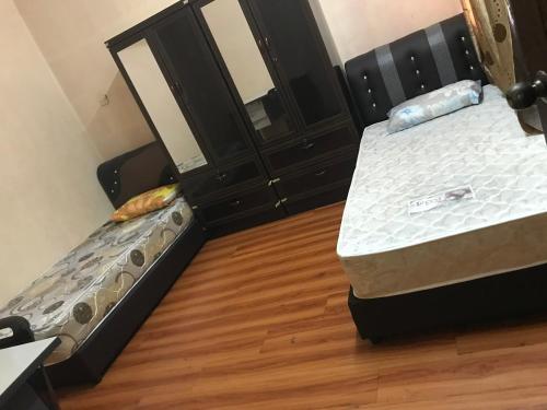 Postel nebo postele na pokoji v ubytování 3999 Sejahtera Homestay