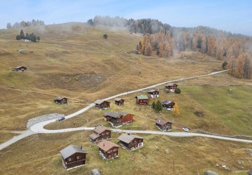 an aerial view of a house on a hill at Maiensäss Stafel 45 in Mutten